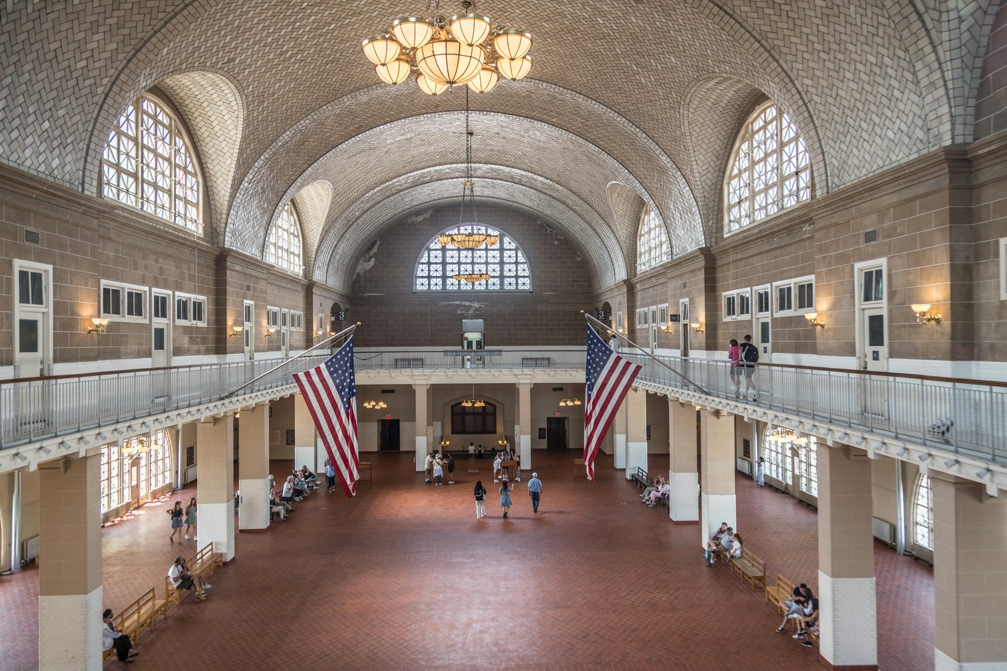 The Great Hall on Ellis Island with its tiled vaulted ceiling and American flags